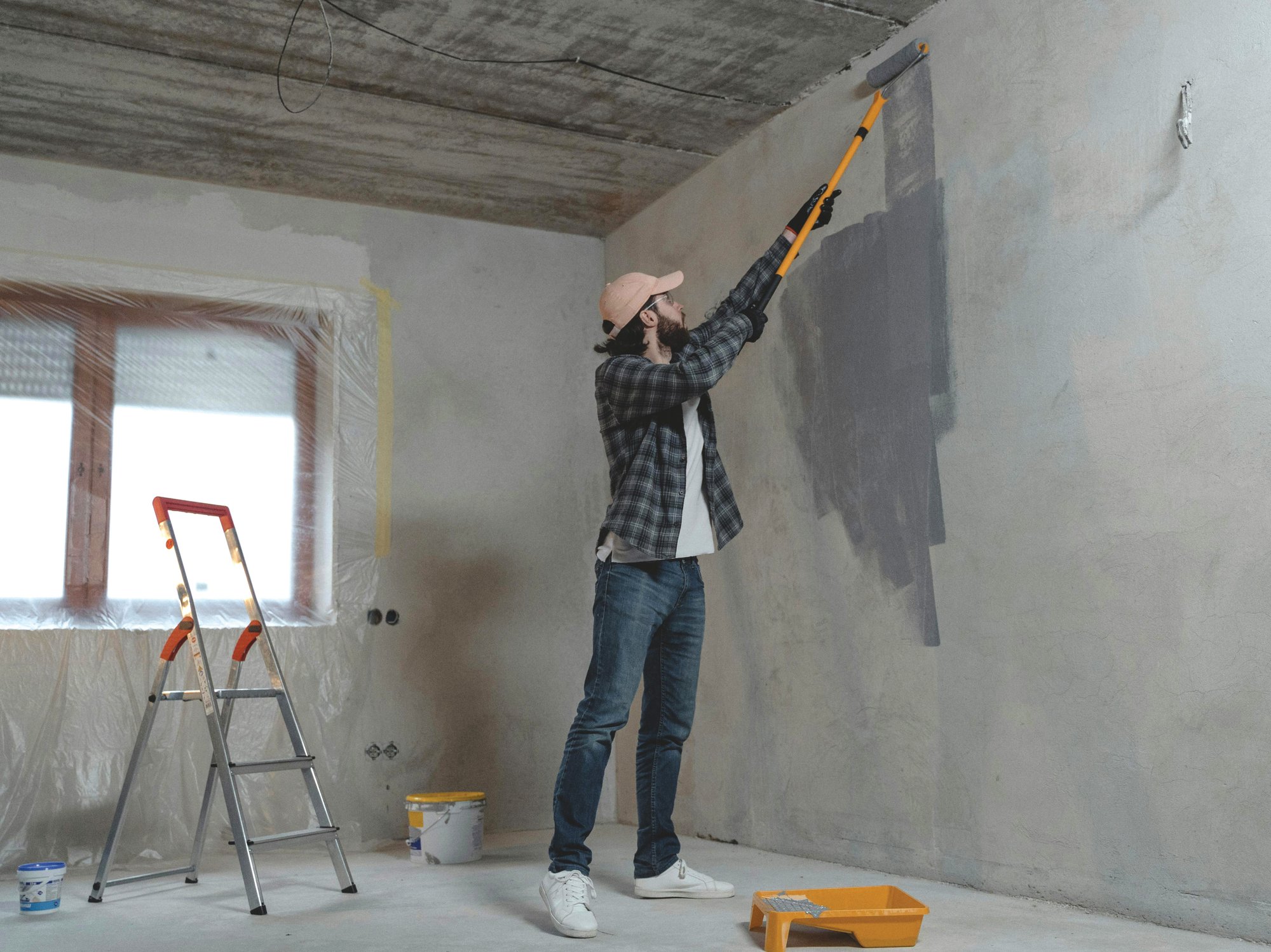 Man painting room for remodel